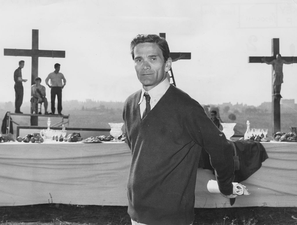 Italian director Pier Paolo Pasolini in front of a biblical scene during the filming of 'The Gospel as Mattheus', circa 1962. Printed following the murder of Pasolini in November 1975. (Photo by Keystone/Hulton Archive/Getty Images)